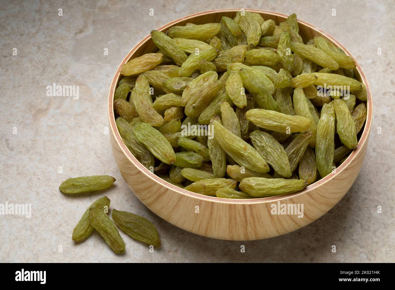 Bowl with green sweet Afghans raisins close up Stock Photo