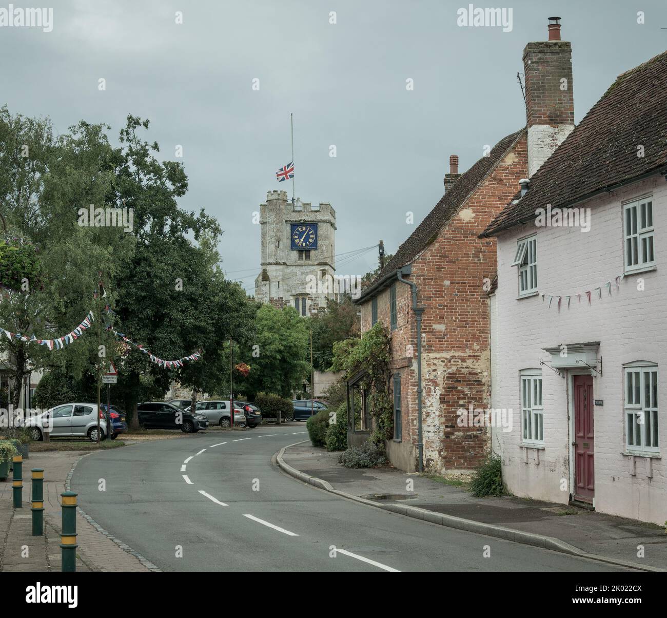 Fordingbridge, Hampshire, UK, 9th September 2022, a nation in mourning. A union jack flag flies at half mast over St Mary’s Church on Church Street the day after the death of Her Majesty Queen Elizabeth II. Paul Biggins/Alamy Live News Stock Photo