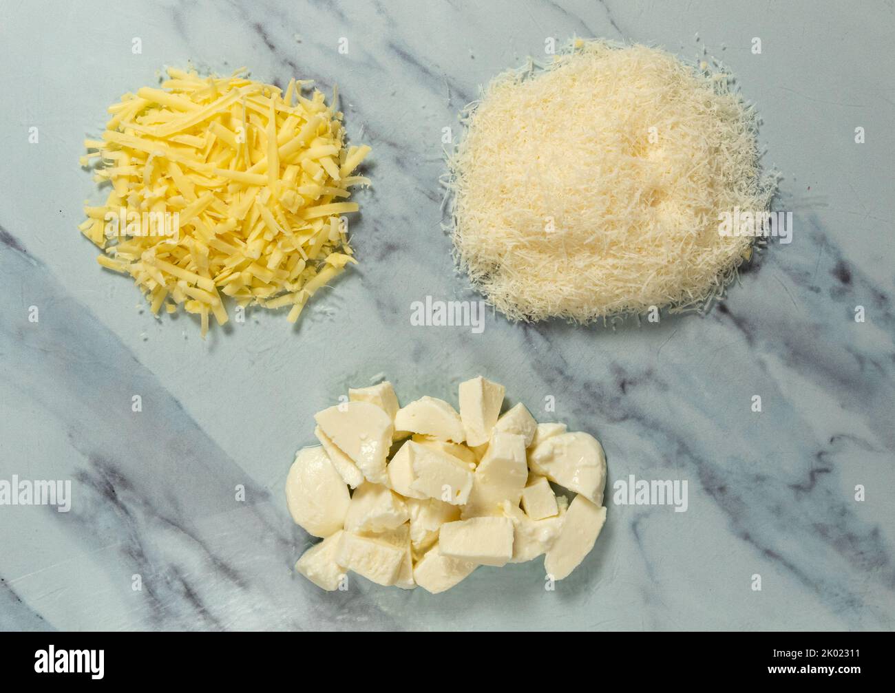 Mozzarella, parmesan and cheddar from above Stock Photo