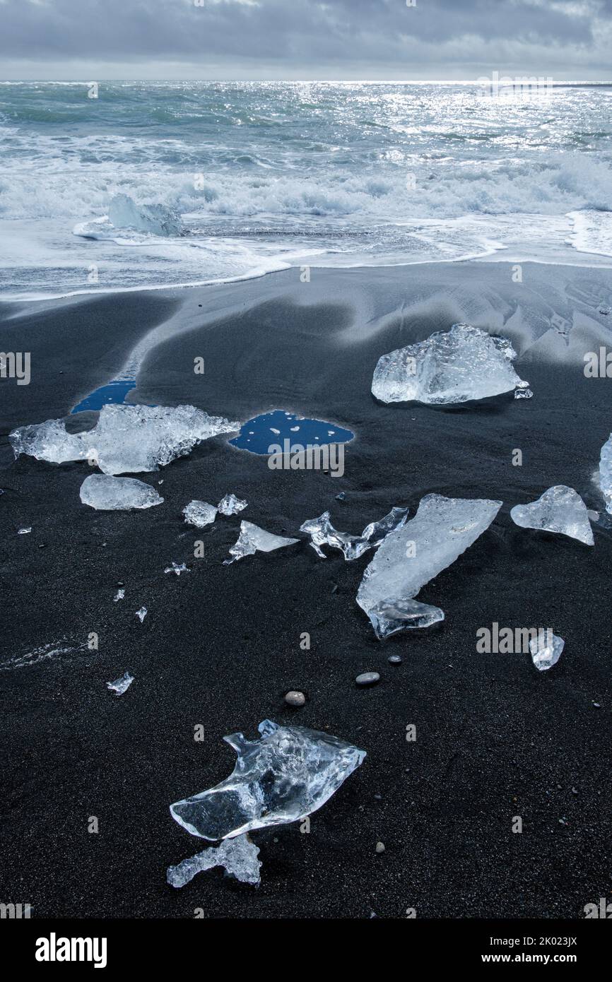 Blocks of ice from the Jokulsarlon glacial lagoon washed up on Diamond Beach, Iceland Stock Photo