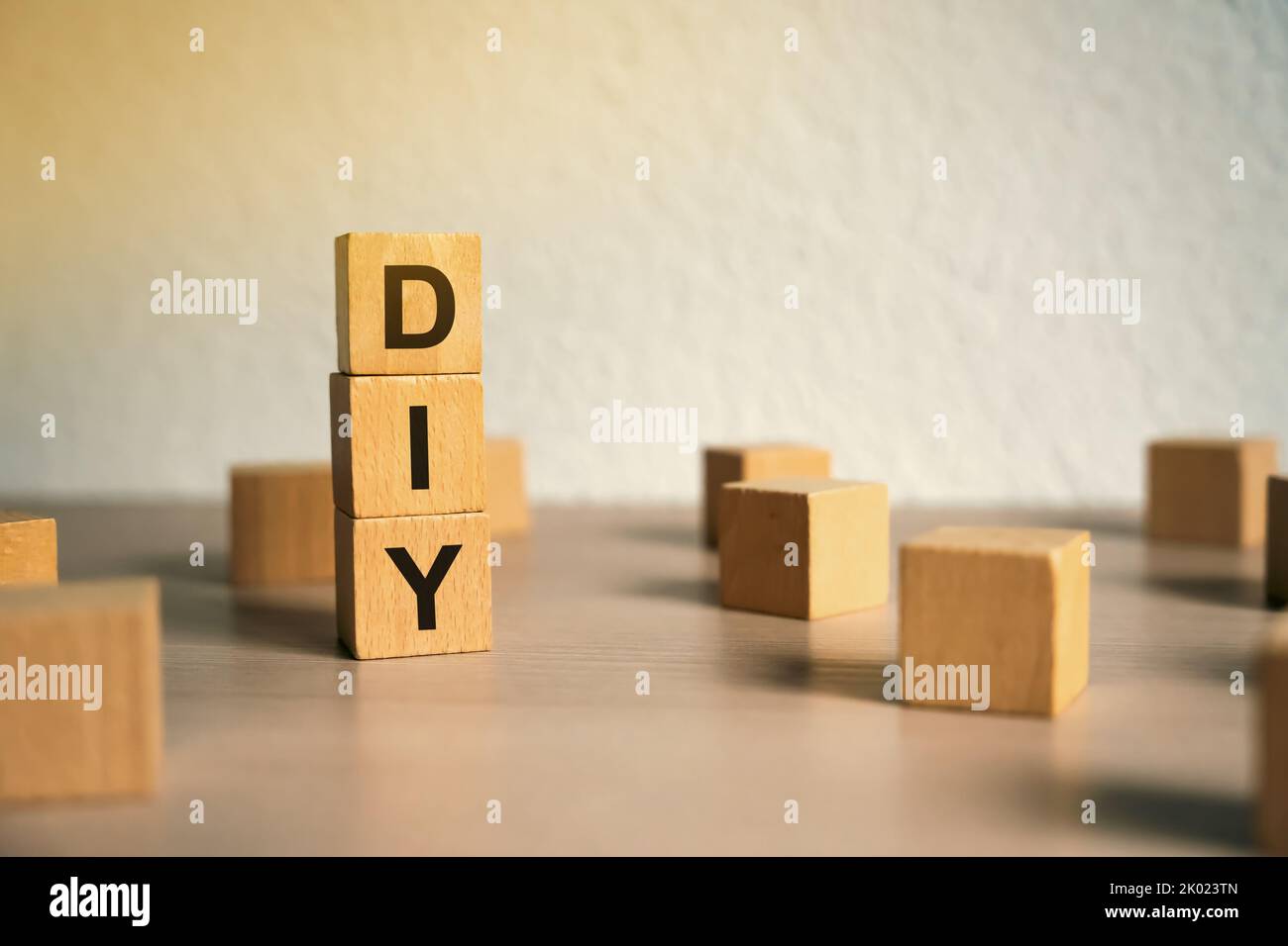 Wooden blocks with the word DIY - Do It Yourself concept. The method of self-creation of things without the help of professionals. Selective focus Stock Photo