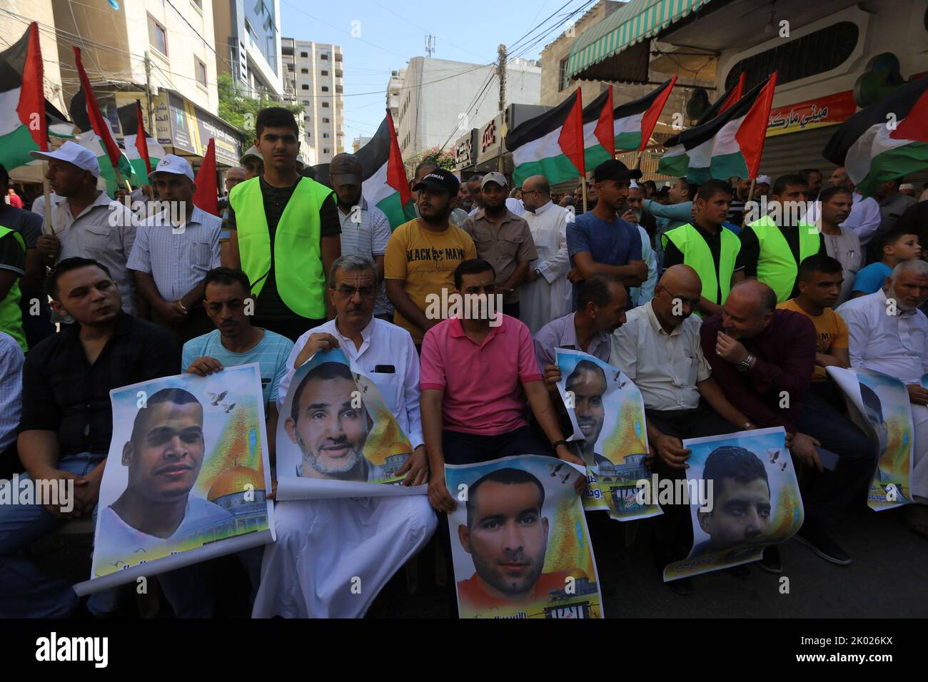 Palestinians carry national flags and pictures of prisoners during a rally after Friday prayers in Khan Younis in the Southern Gaza Strip, to express support for the Al-Aqsa Mosque and Palestinian prisoners in Israeli prisons, on Friday, September 9, 2022. Photo by Ismael Mohamad/UPI Credit: UPI/Alamy Live News Stock Photo