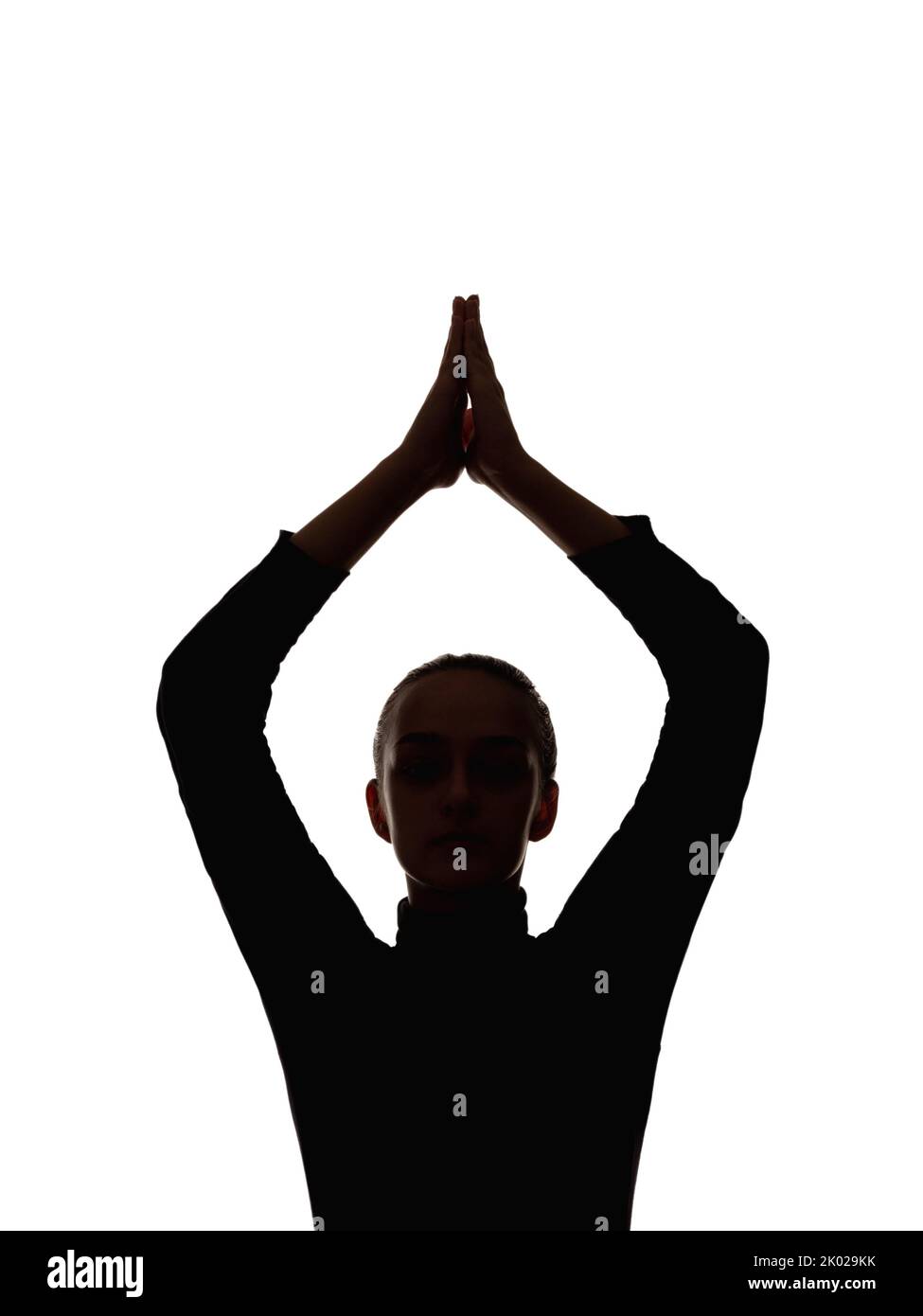 female silhouette yoga meditation relaxed woman Stock Photo