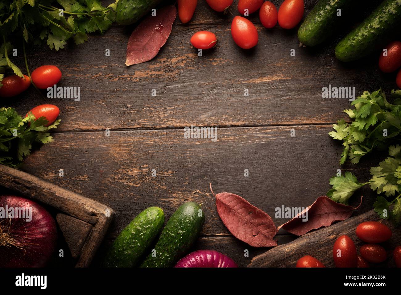 Background vegetables autumn harvest. Tomatoes and cucumbers with ...