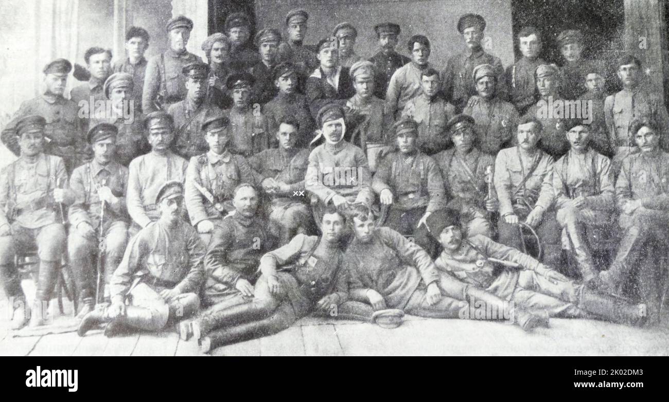 The head of the 25th rifle division V.I. Chapaev (x) and the commissioner of the division D.A. Furmanov (xx) among the commanders and political workers of the division. July 1919. Stock Photo