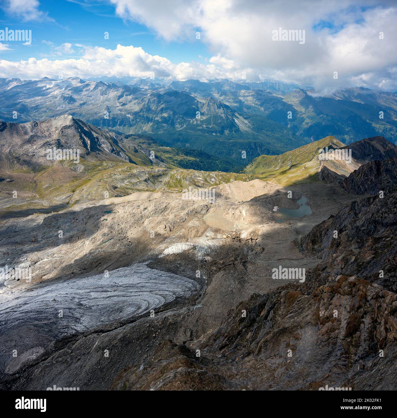 view from the mountain Kitzsteinhorn across the remains of the glacier Schmiedingerkees north onto the Kitzbühler Alps in summer, Austria Stock Photo