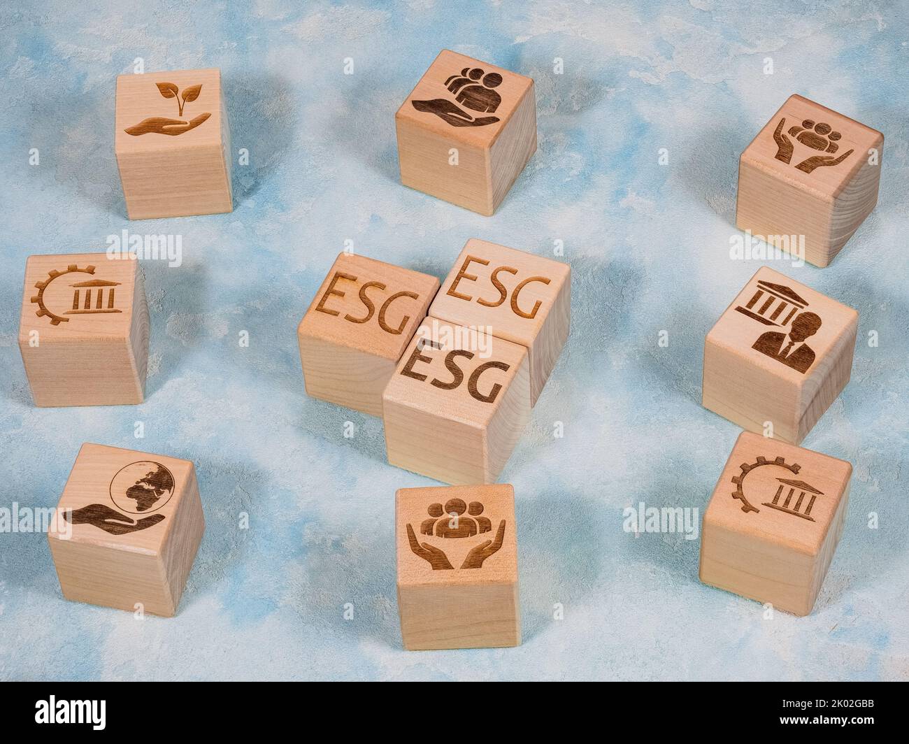 ESG text and symbols on wooden cubes as environmental conservation and renewable resource concept Stock Photo