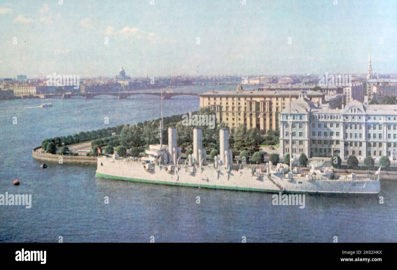The cradle of the Great October Socialist Revolution is the hero city of Leningrad. At the promenade - the legendary cruiser Aurora. Stock Photo
