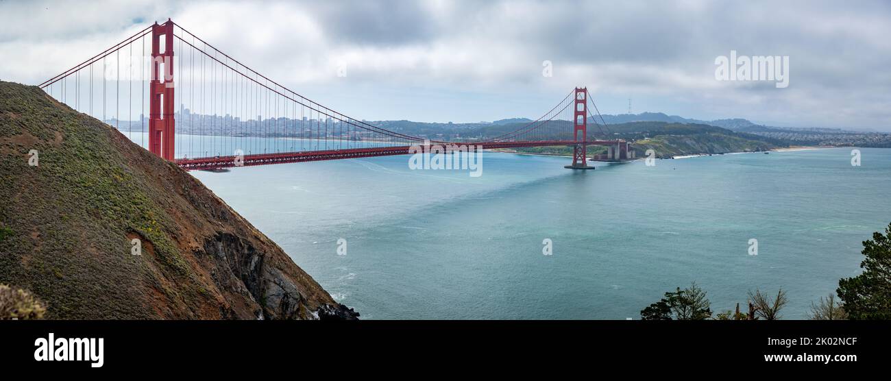 A panoramic view of San Francisco's Golden gate bridge on a cloudy day ...