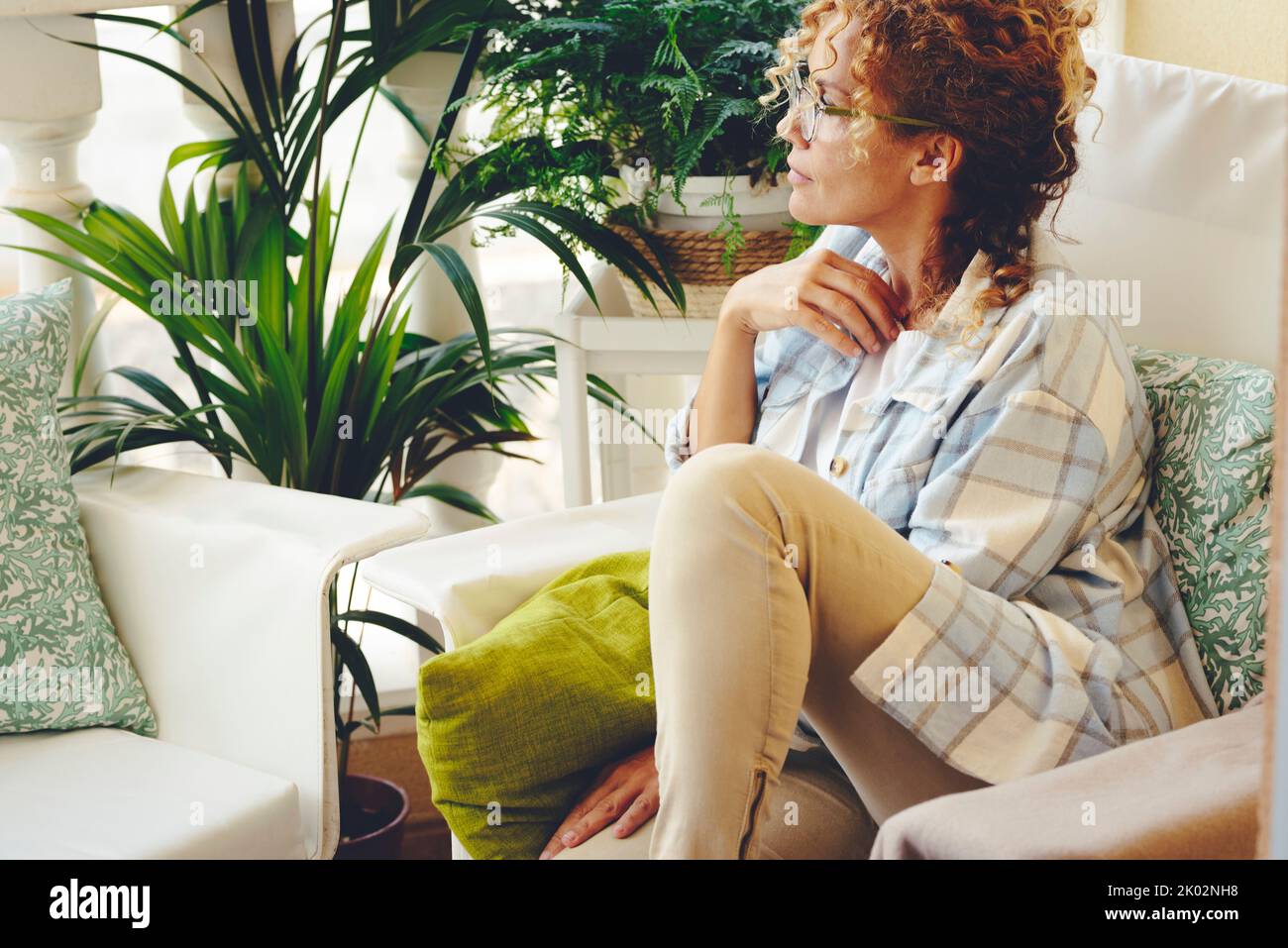 Mature woman alone home worried hi-res stock photography and images - Alamy