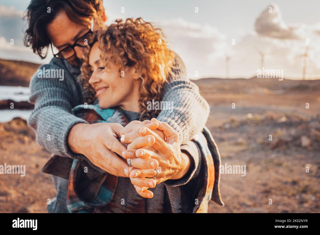 Romance and love people in outdoors. Man and woman with hands together enjoy relationship and leisure activity. Country side beautiful estination travel in background. Happy couple smile and love Stock Photo