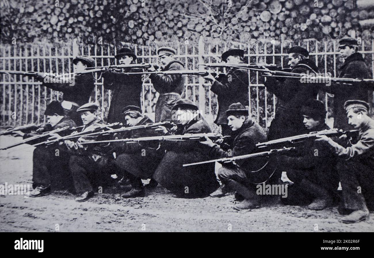Fighting squad of Putilovites at shooting lessons. Petrograd, October - November 1917. Photo by J. Steinberg. Stock Photo