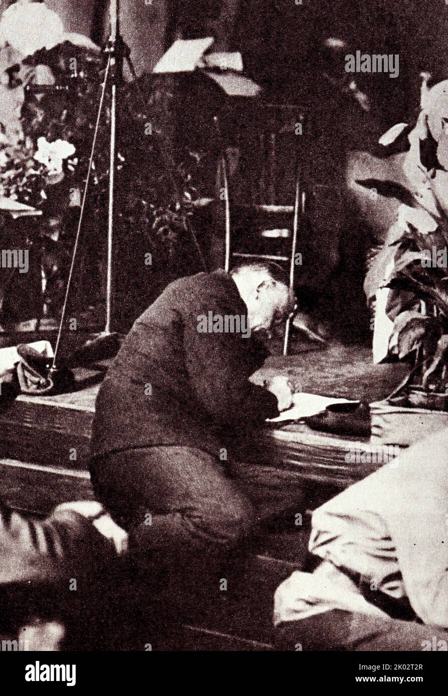 Vladimir Lenin on the steps of the rostrum during a meeting of the third congress of the Comintern in the former Andreevsky Hall of the Kremlin. 1921, June 28. Moscow. Original. Photographer - Bulla V. K. Stock Photo