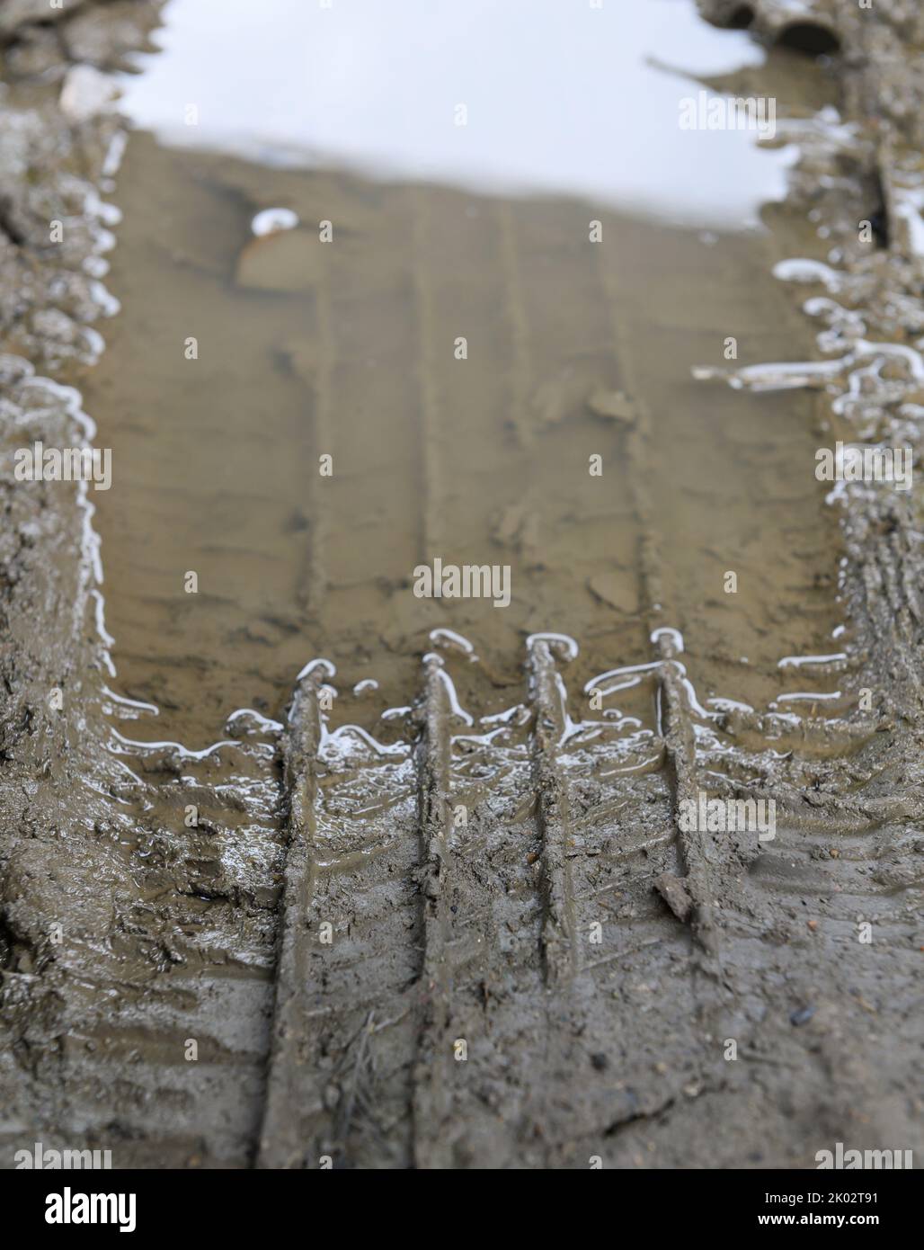 Close up of lorry tire track with mud water Stock Photo