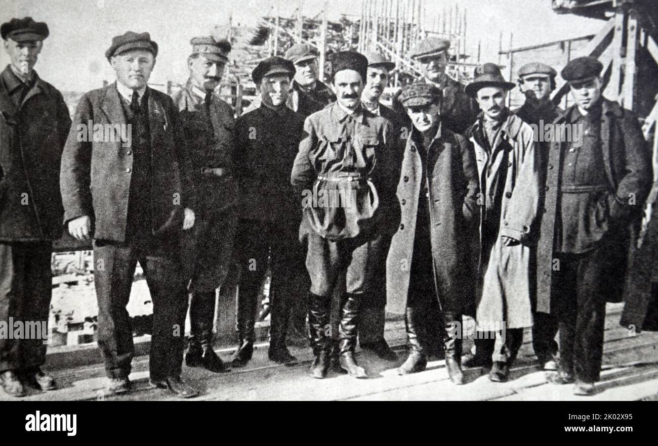 G. K. Ordzhonikidze, S. M. Kirov and A. I. Mikoyan at the construction of the Volkhovskaya hydroelectric power station. 1924. Stock Photo