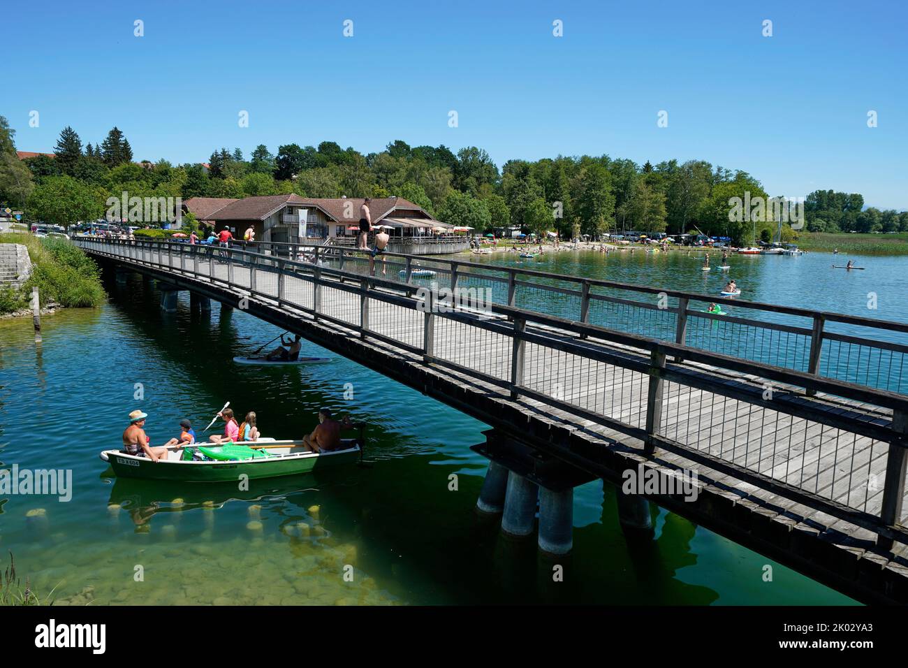 Germany, Bavaria, Upper Bavaria, Traunstein county, Waging am See, Tettenhausen, Lake Waginger, Boadwirt restaurant, footbridge, bathing boat Stock Photo