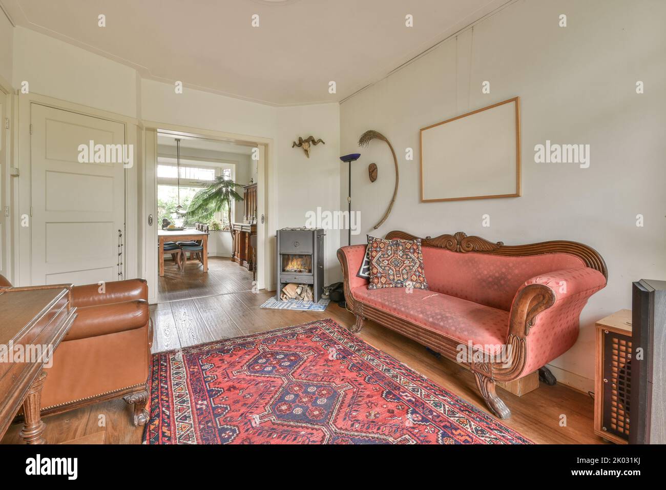 piano and carpet placed in light hall of modern cottage with glass door