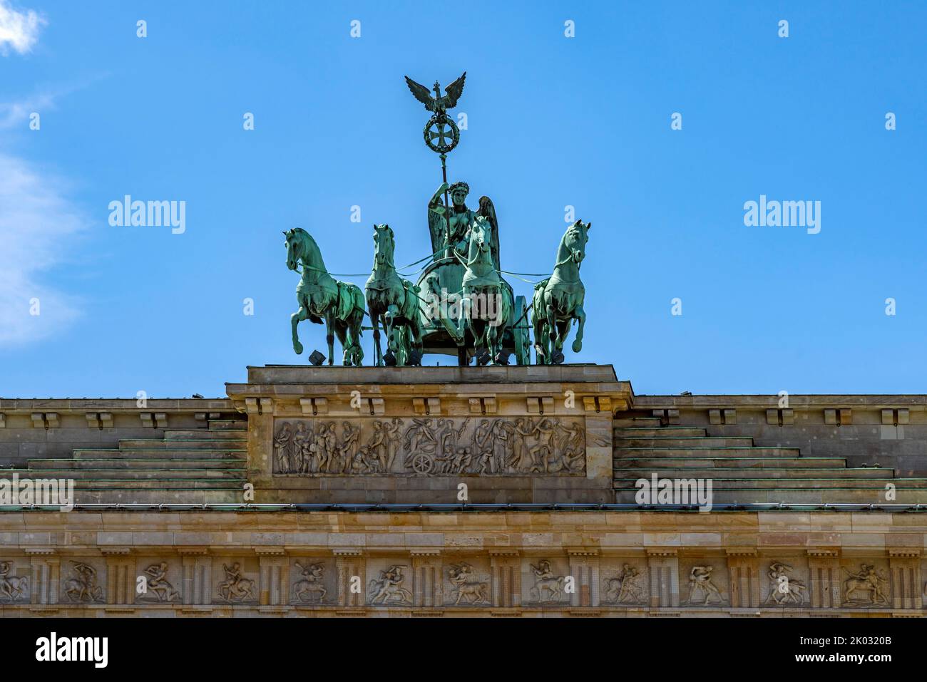 Quadriga on the Brandenburg Gate built in the years 1789 to 1793. The Brandenburg Gate in Berlin is an early classicist triumphal gate, which stands on Pariser Platz in Berlin's Mitte district. The gate is the only preserved of last 18 Berlin city gates. Stock Photo