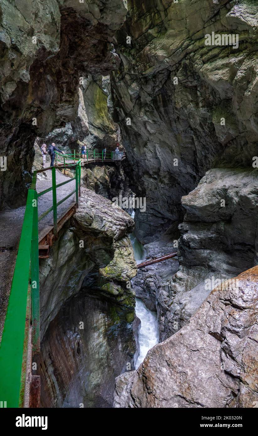 The Breitachklamm is a gorge created by the Breitach river in the Allgäu near Tiefenbach, a district of the municipality of Oberstdorf. It is about 150m deep and next to the Höllentalklamm the deepest gorge in the Bavarian Alps. Around 300, 000 visitors hike through the 2.5 km long gorge every year. Stock Photo