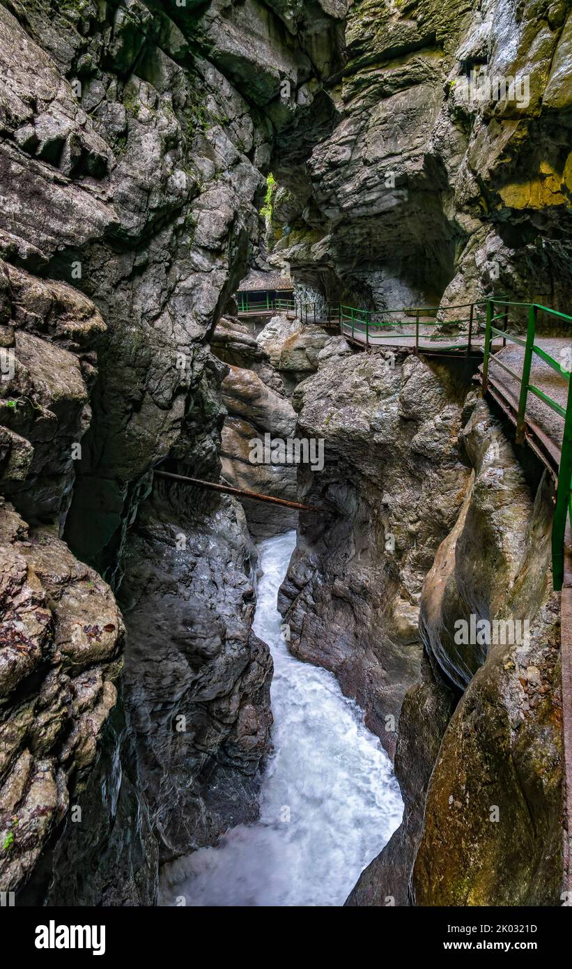 The Breitachklamm is a gorge created by the Breitach river in the Allgäu near Tiefenbach, a district of the municipality of Oberstdorf. It is about 150m deep and next to the Höllentalklamm the deepest gorge in the Bavarian Alps. Around 300, 000 visitors hike through the 2.5 km long gorge every year. Stock Photo