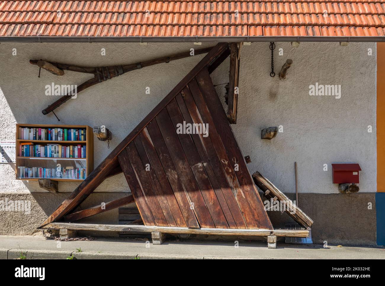 Historic snowplow pulled by horses through the village. Stock Photo