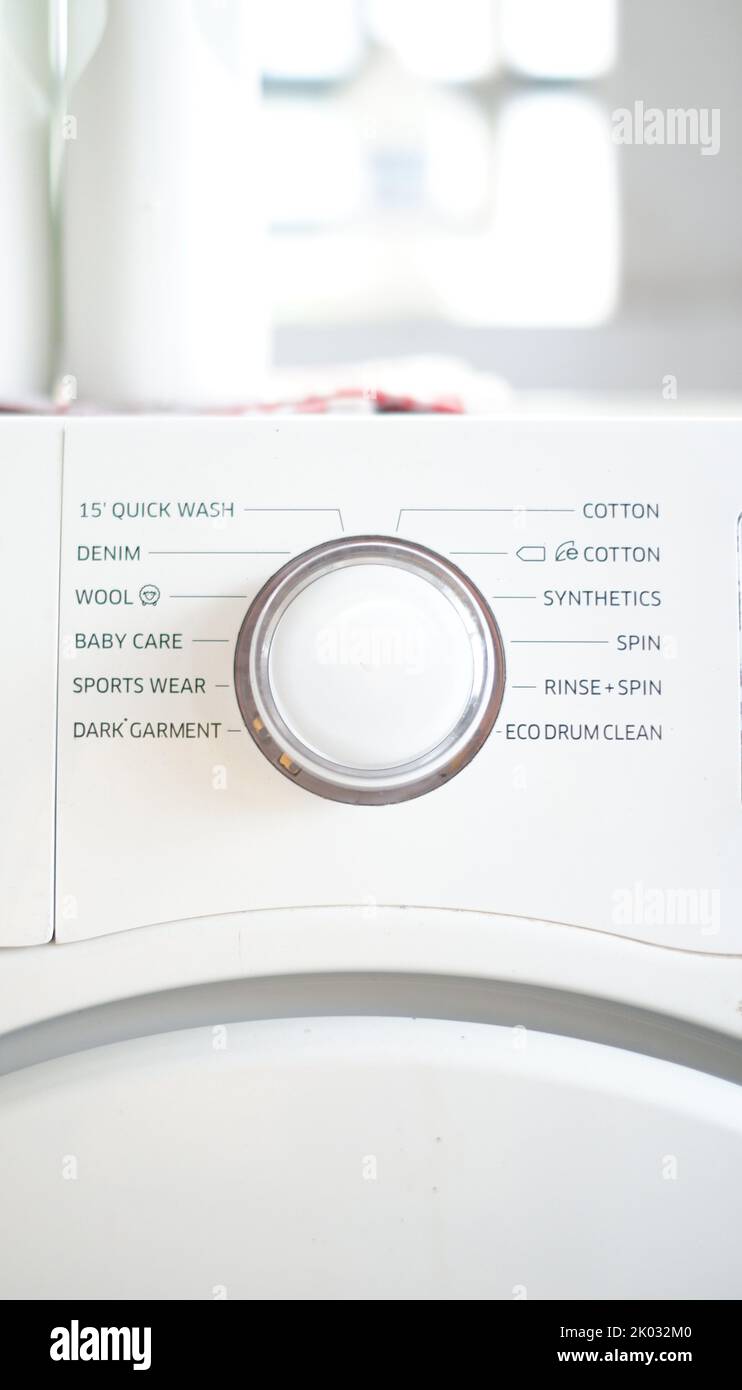 A vertical shot of the washing machine control programming panel with