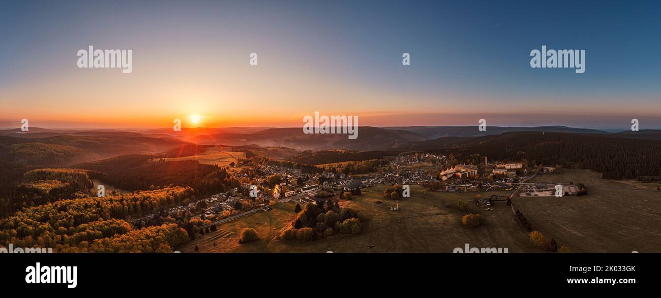 Germany, Thuringia, Masserberg, Rennsteig, village, Regiomed rehab clinic, mountains, valleys, forest, overview, sunrise, backlight, aerial photo, panorama Stock Photo