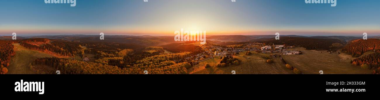 Germany, Thuringia, Masserberg, Rennsteig, village, Regiomed rehab clinic, mountains, valleys, forest, overview, sunrise, partly backlight, aerial view, 360° panorama Stock Photo