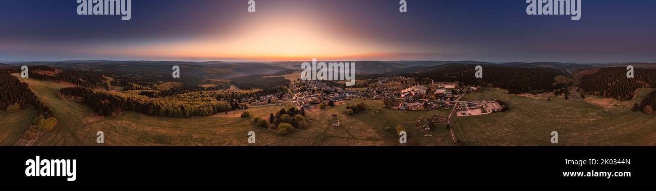 Germany, Thuringia, Masserberg, Rennsteig, village, Regiomed Rehaklinik, mountains, valleys, forests, mountain meadows, overview, dawn, partly backlight, 360° panorama, aerial photo Stock Photo