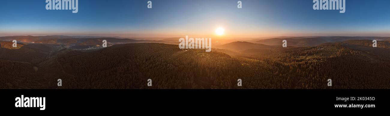 Germany, Thuringia, Ilmenau, Kickelhahn, observation tower, Telekom tower, city, sunrise, forest, mountains, partly backlight, 360° panorama Stock Photo