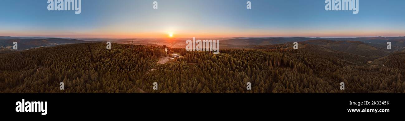Germany, Thuringia, Ilmenau, Kickelhahn, observation tower, Telekom tower, city, sunrise, forest, mountains, partly backlight, 360° panorama Stock Photo