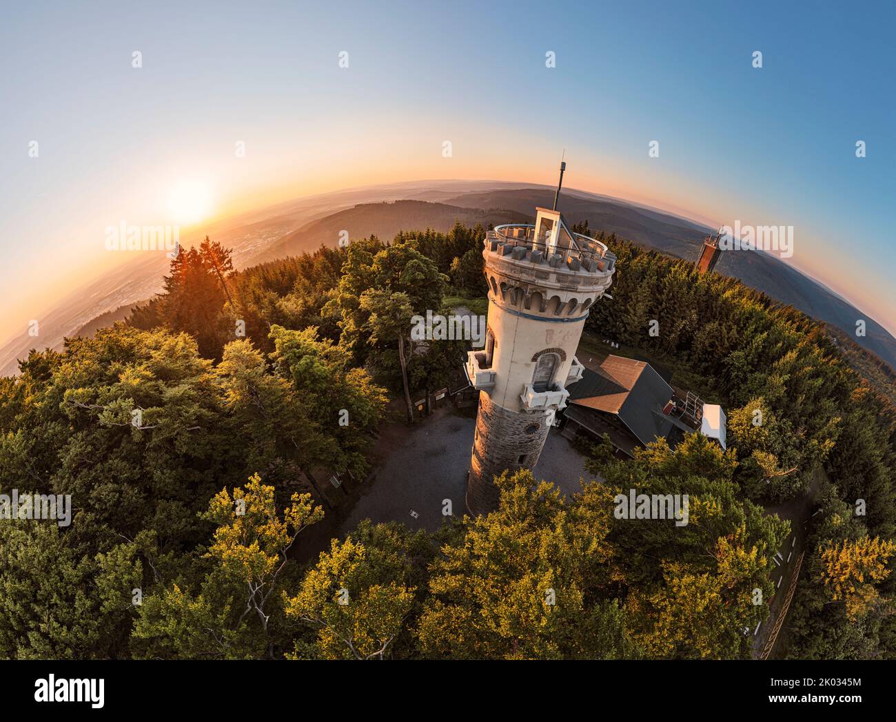 Germany, Thuringia, Ilmenau, Kickelhahn, observation tower, telekom tower (background), sunrise, forest, mountains, hemisphere panorama Stock Photo