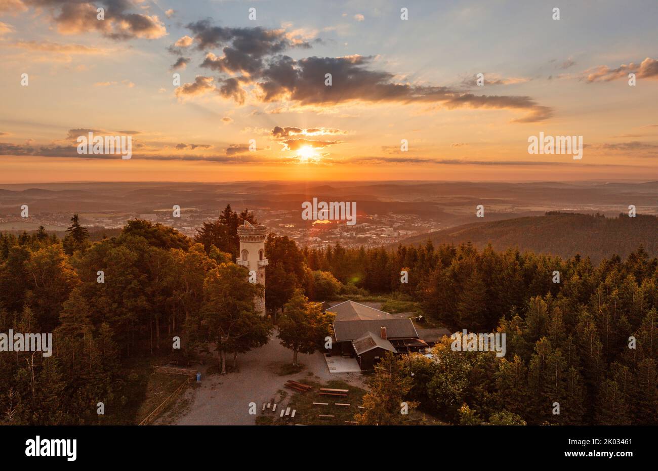 Germany, Thuringia, Ilmenau, Kickelhahn, observation tower, restaurant, rest area, city (background), forest, mountains, sunrise, overview Stock Photo