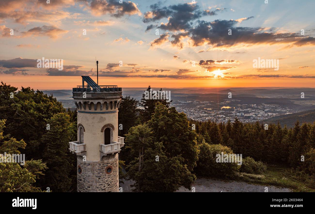 Germany, Thuringia, Ilmenau, Kickelhahn, lookout tower, city, forest, mountains, sunrise, backlight Stock Photo