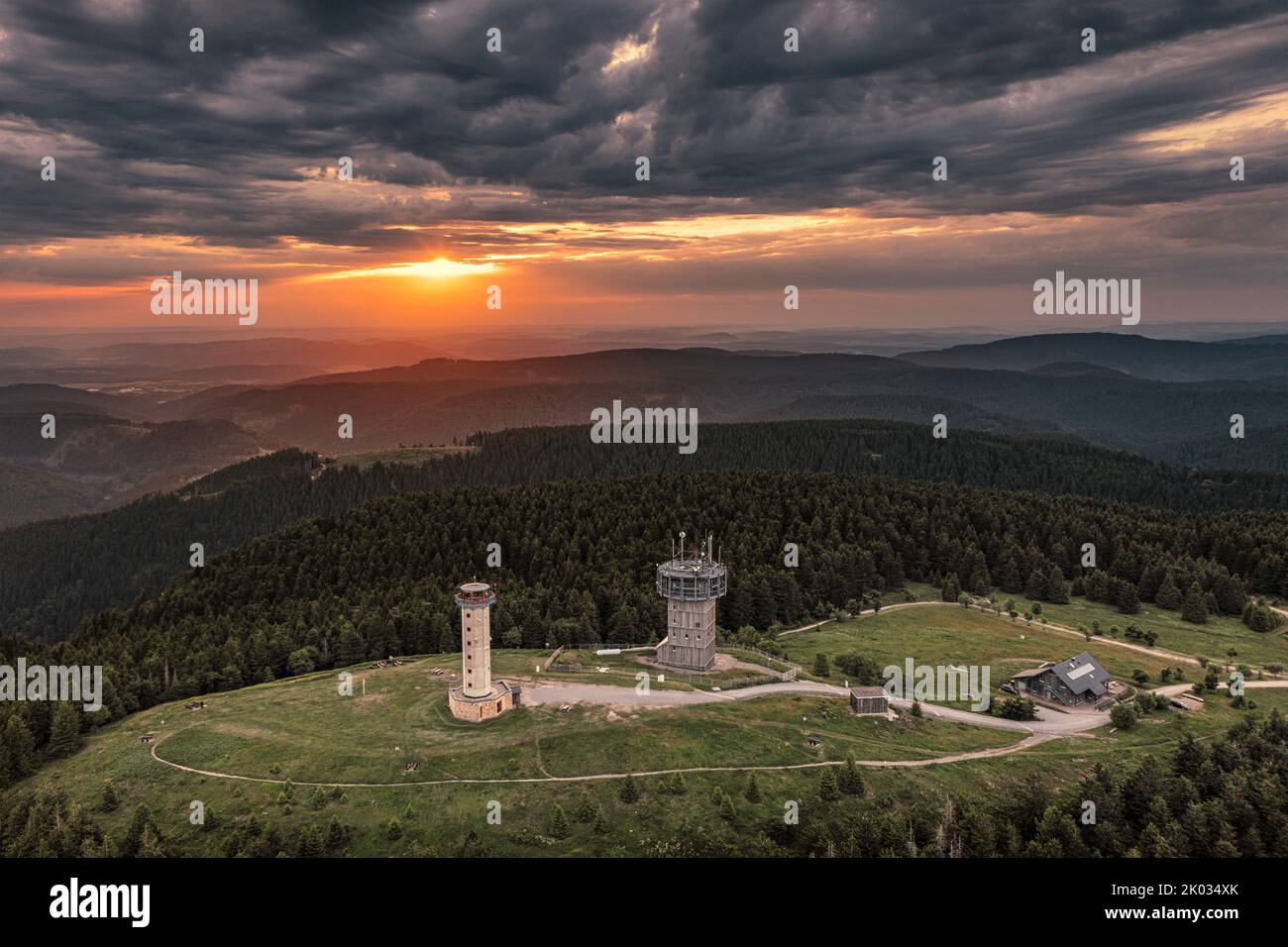 Germany, Thuringia, Suhl, Gehlberg, Schneekopf (second highest mountain of Thuringian Forest), observation and climbing tower, telecommunication tower, hut, forest, mountains, sun, backlight, overview, aerial photo Stock Photo