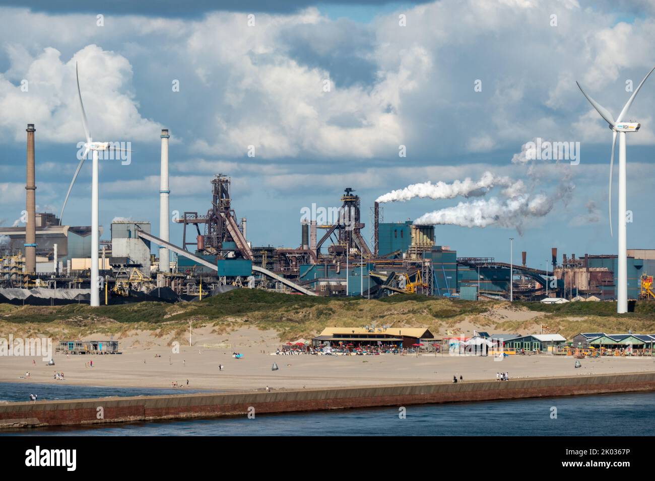 People enjoy the beach of Ijmuiden near the Tata Steel plant on News  Photo - Getty Images