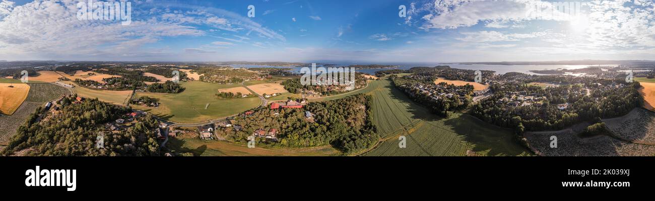 Norway, Vestfold, Larvik, Bergeskogen, Rekkevik, settlements, fields, fjord (background), fields, forest, overview, aerial view, partly backlight, 360° panorama Stock Photo