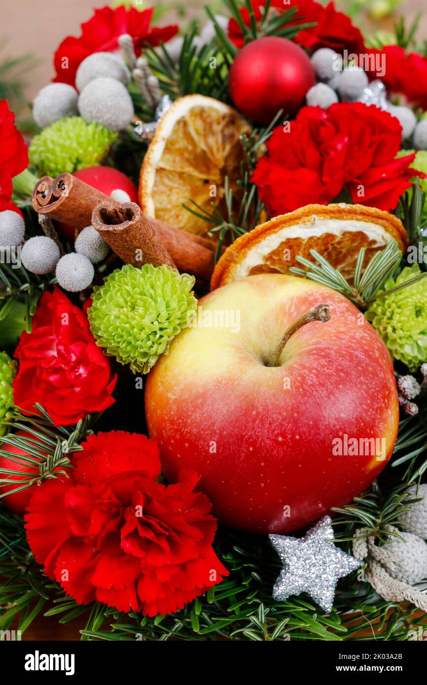 Floral arrangement with carnations, chrysanthemum santini flowers and fir. Party decor Stock Photo