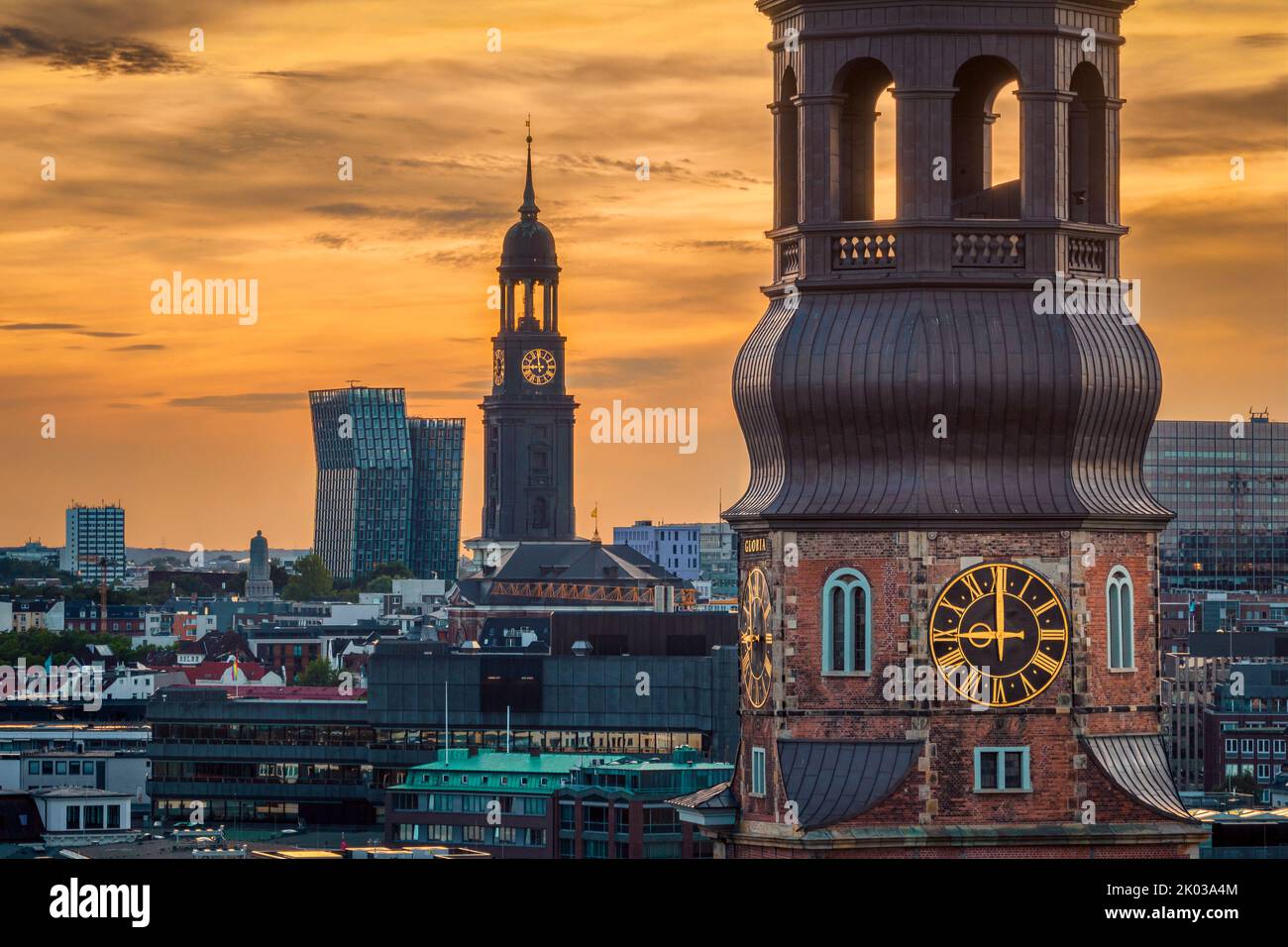 Church towers in Hamburg, Germany during sunset Stock Photo