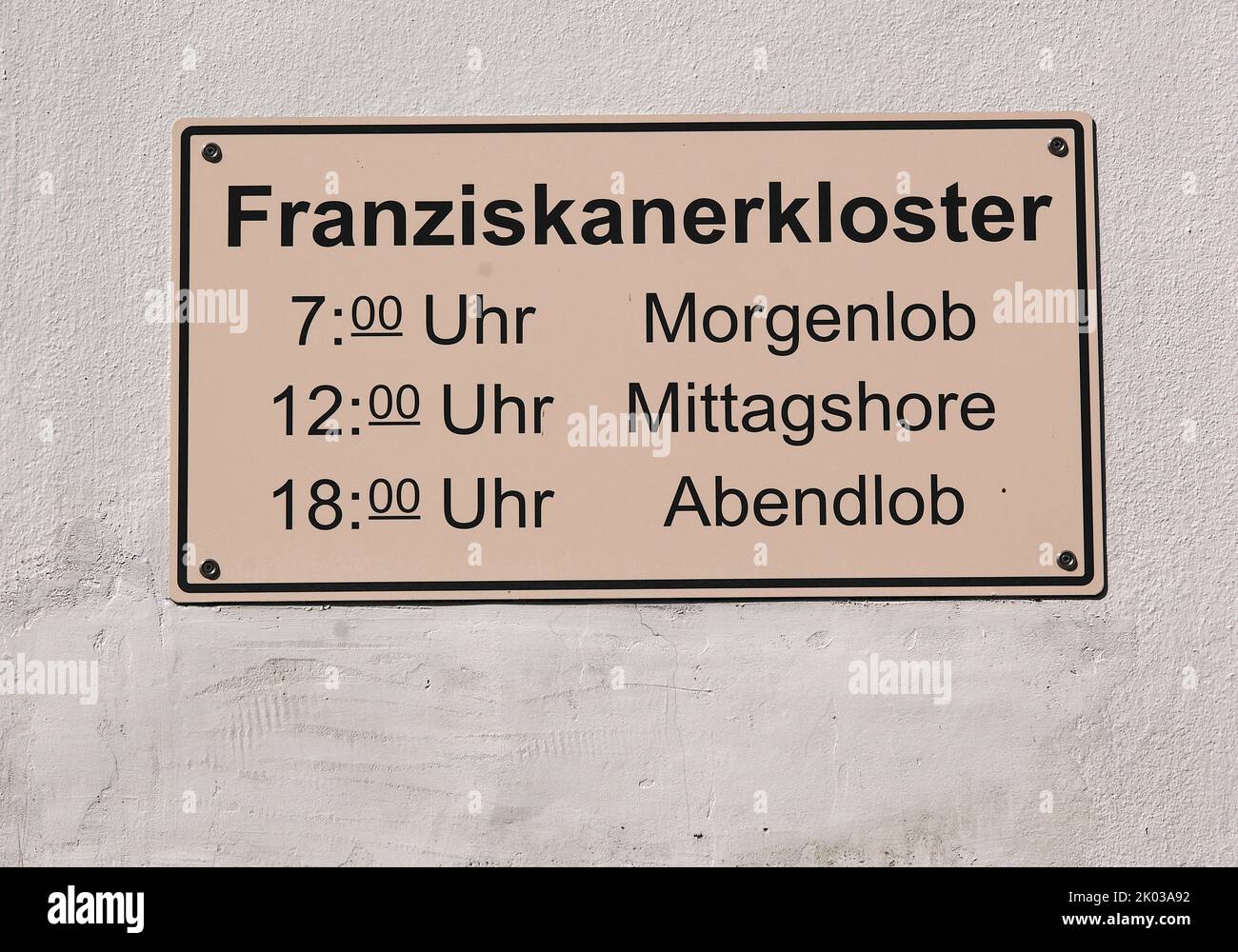 Sign with schedule for Liturgy of the Hours, Morning Praise, Midday Shore, Evening Praise, Marienthal Monastery, Franciscan Monastery and Pilgrimage Church, Geisenheim, Rheingau, Taunus, Hesse, Germany Stock Photo