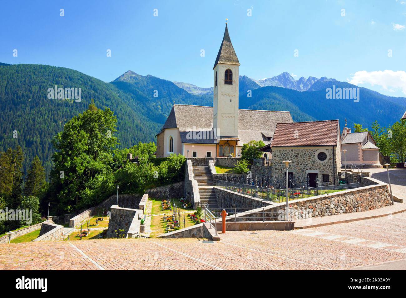 Village church of Sankt Walburg with cemetery in the South Tyrolean Ulten Valley Stock Photo