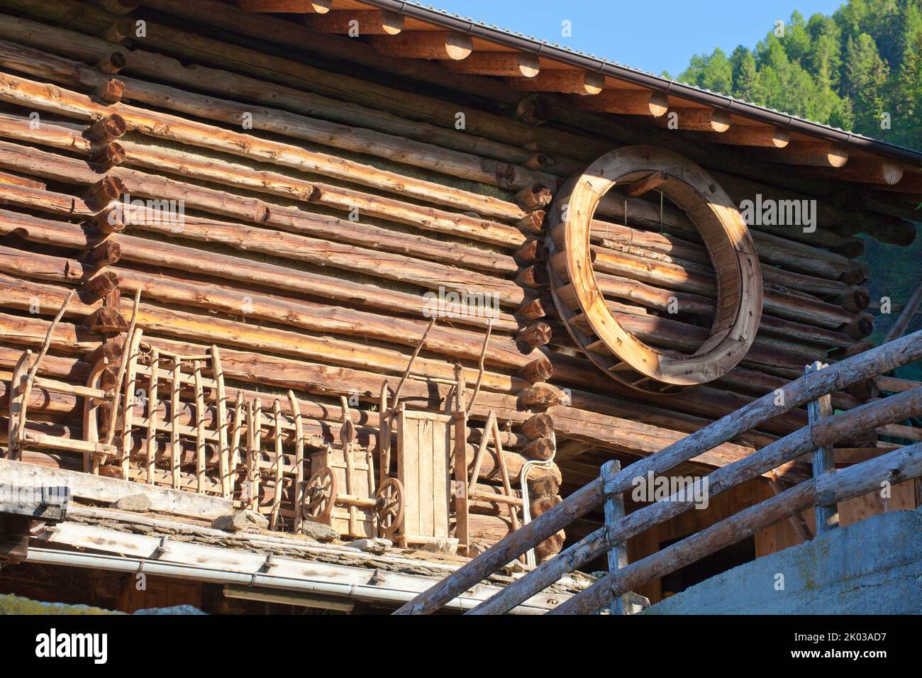 agricultural equipment made of wood as a souvenir on the stable wall from the mountain farm in the South Tyrolean Ulten Valley Stock Photo