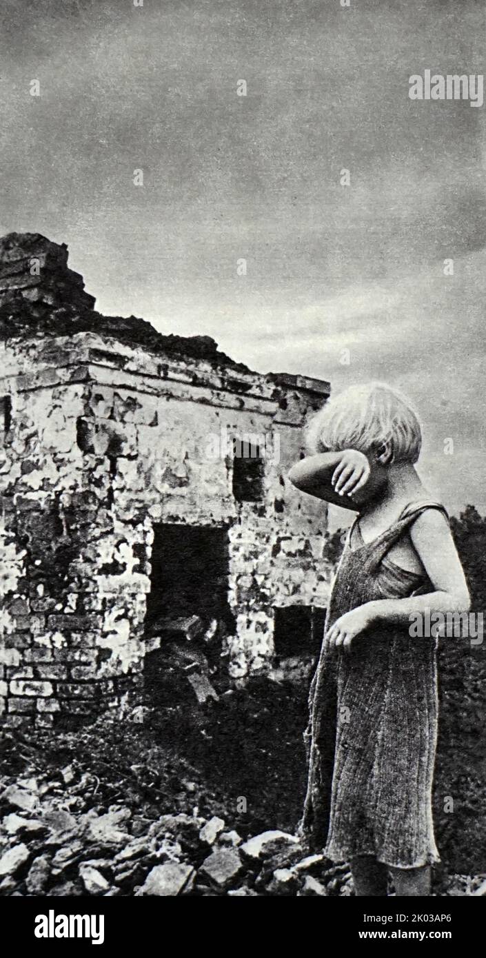 USSR June 1941. An orphan at the ruins after the bombing. Russia. World War Two. Stock Photo
