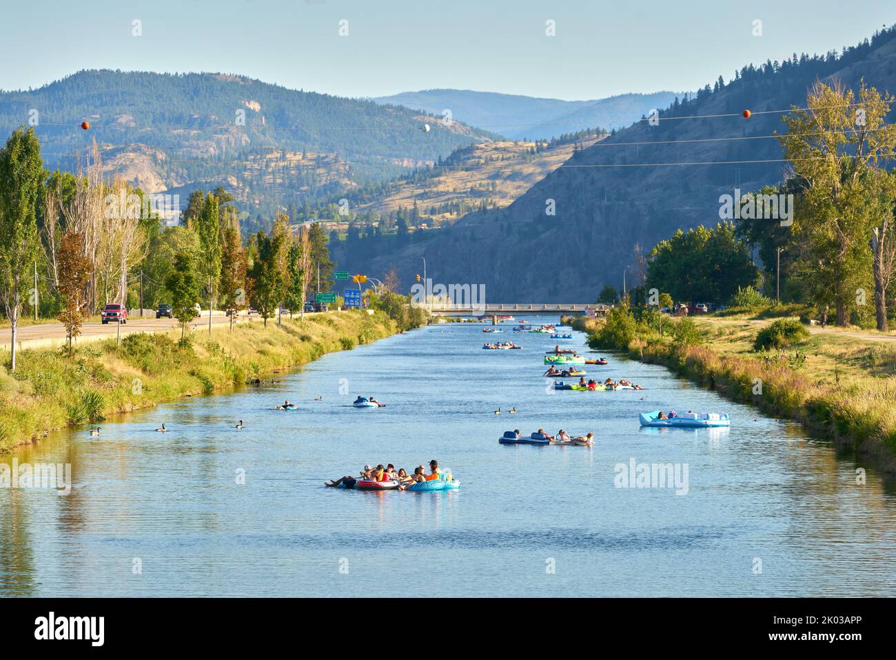 Penticton, British Columbia, Canada – July 20, 2019 Penticton River Channel Float. People drifting down the Penticton Channel in summer. Stock Photo