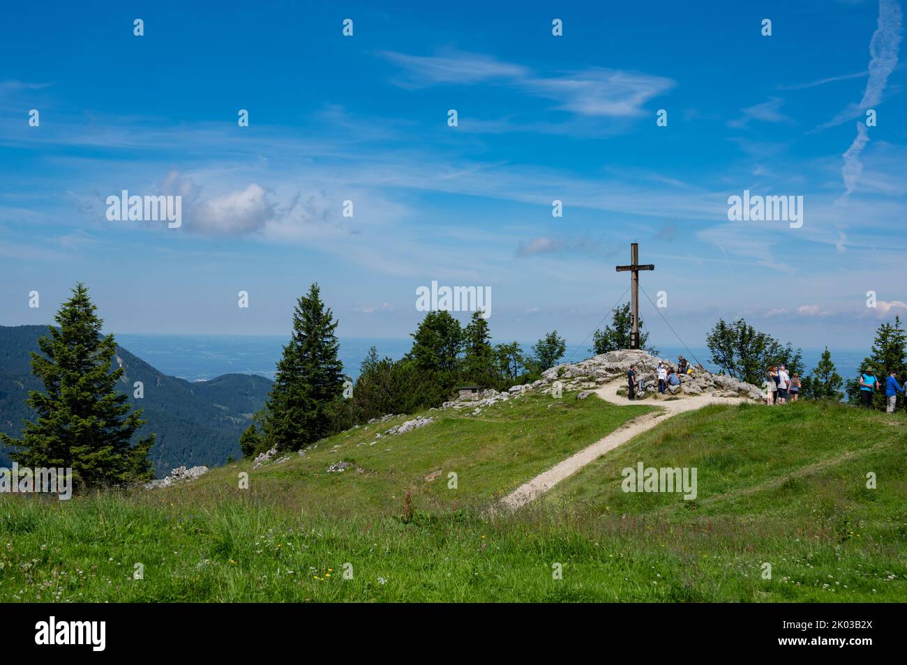 Aschau, Bavaria, Germany - July 14, 2020: Tourists visit the devotional summit cross on the Kampenwand mountain, Bavaria Stock Photo