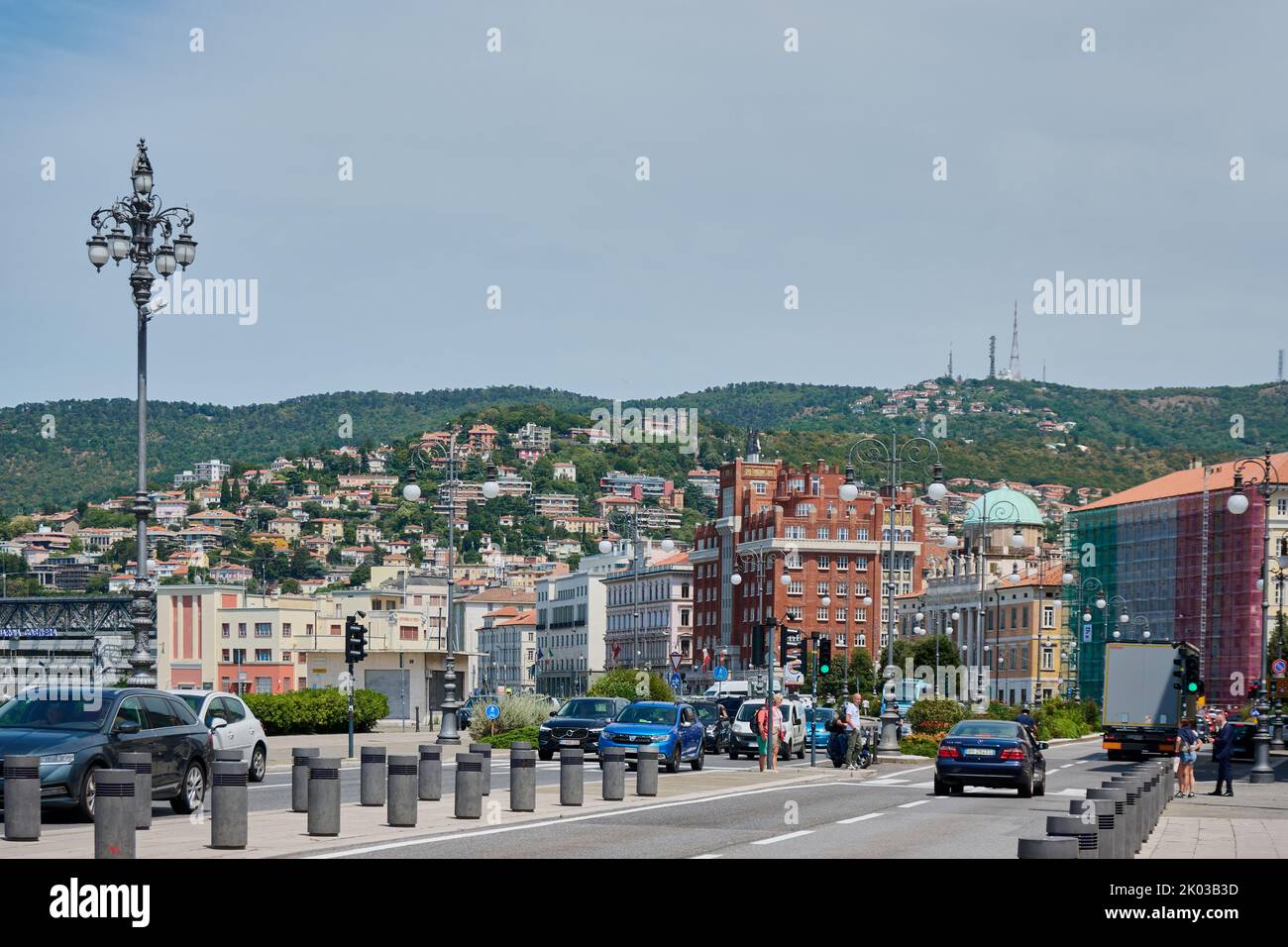 Trieste, Italy - July 26, 2022: tourists and cars in the main road near the city center of Trieste, Italy Stock Photo