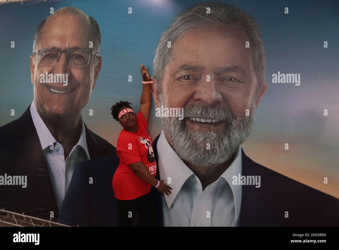 A woman poses with a photo of former President and presidential candidate Luiz Inacio Lula da Silva and candidate for vice presidency Geraldo Alckmin, before a meeting between Lula and evangelical leaders in Sao Goncalo in Rio de Janeiro state, Brazil September 9, 2022. REUTERS/Pilar Olivares Stock Photo