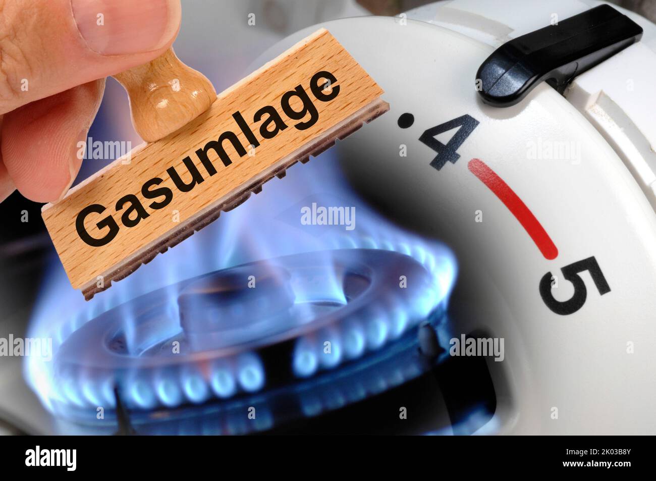 Gas flame, gas apportionment is printed on a wooden stamp Stock Photo