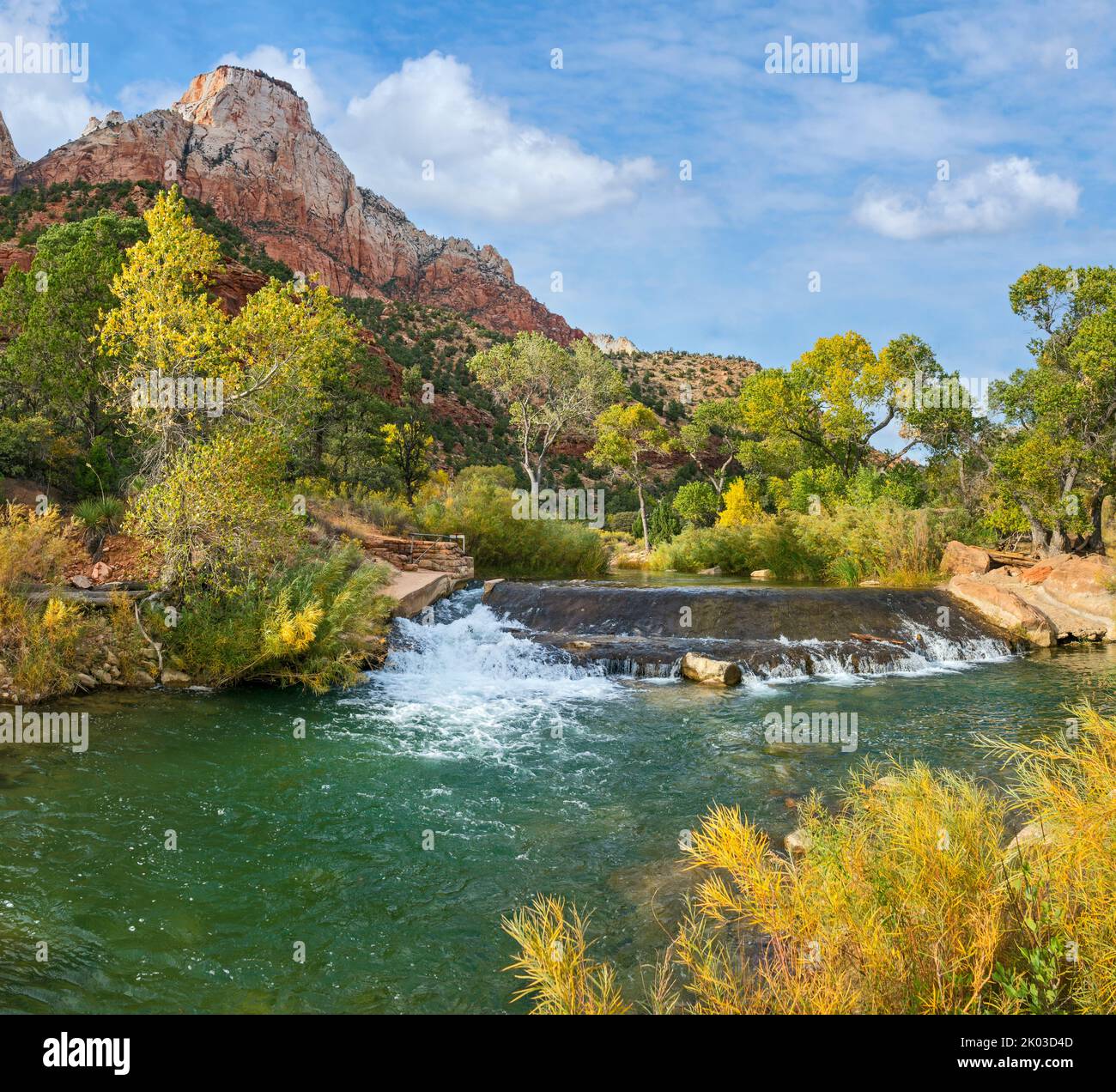 Zion National Park is located in southwestern Utah on the border with Arizona. It has an area of 579 kö² and lies between 1128 m and 2660 m altitude. Virgin River, old dam at Canyon Junction shuttle stop. Stock Photo
