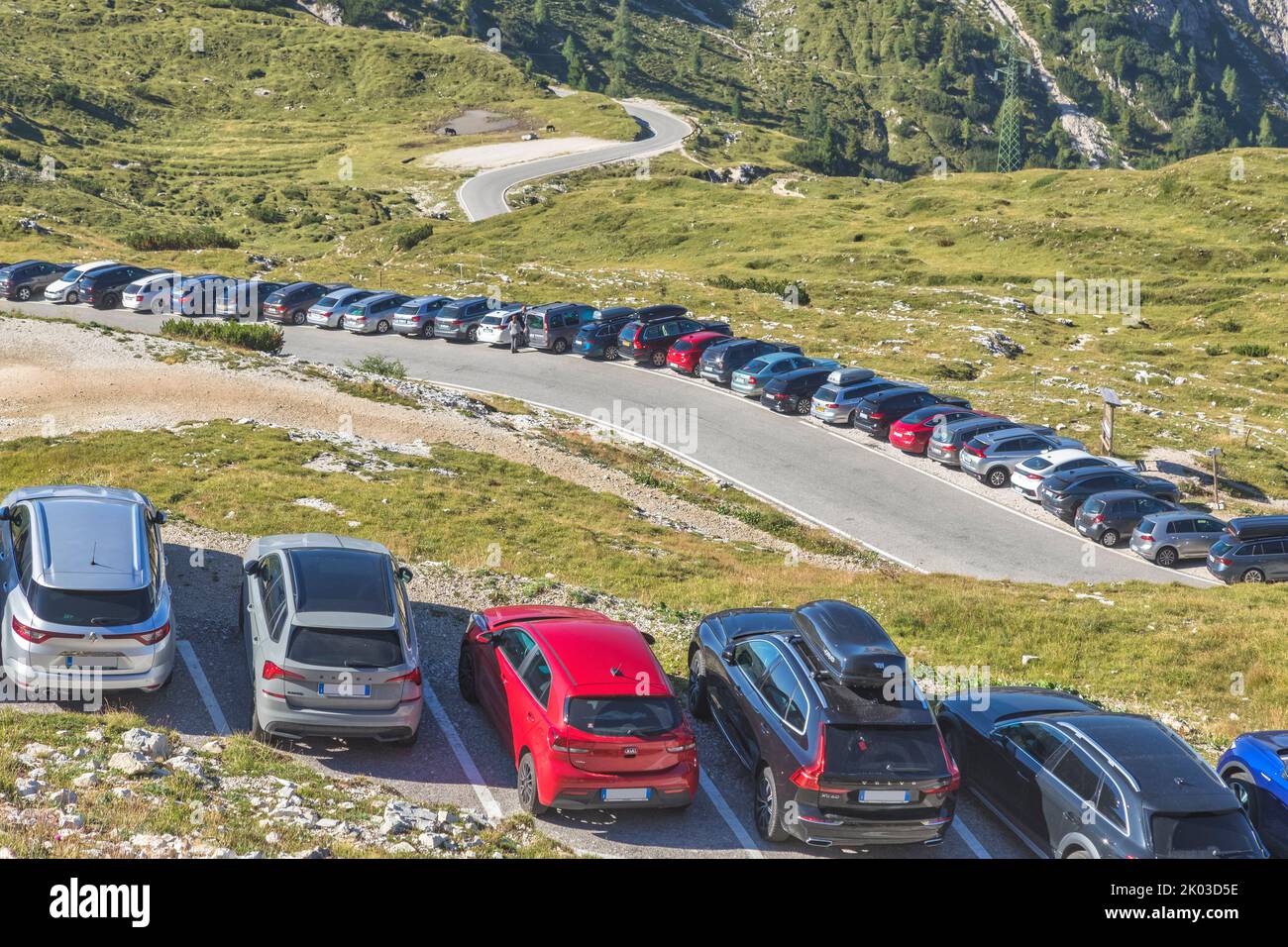 Italy, Veneto, Auronzo di Cadore, Dolomites. Summer tourism in the Tre Cime di Lavaredo area, multitude of cars parked at high altitude near the Auronzo refuge, noise pollution, traffic, mass tourism Stock Photo